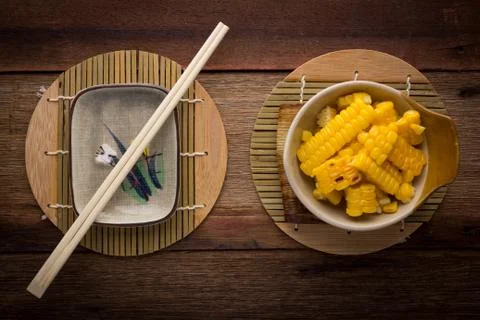 Split corn on wood background Foto stock