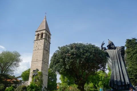 Split, Croatia - 04.23.2025: Gregory of Nin Statue and church tower in old to Stock Photos