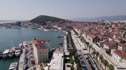 Split, Croatia: Aerial view of the harbor, waterfront promenade and Stock Footage 254387306