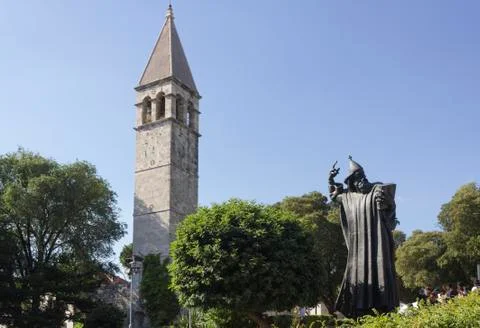 SPLIT, CROATIA - AUGUST 11 2017: Gregory on Nin statue and bell tower in Spli Stock Photos