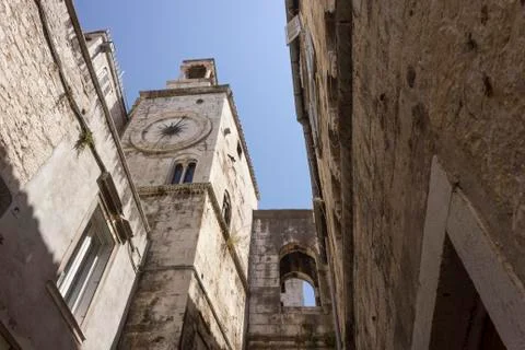 SPLIT, CROATIA - AUGUSt 11 2017: Looking up at the ancient tower clock of Spl Stock Photos