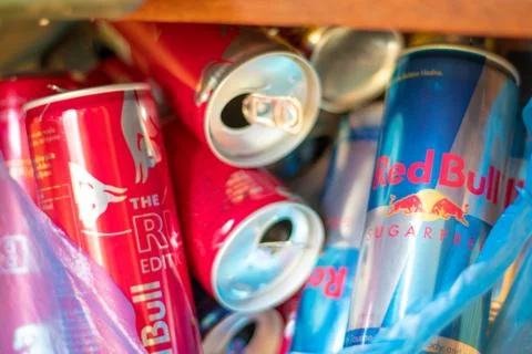 Split Croatia August 2020 Empty red bull red Ruby and blue sugar free cans in Stock Photos