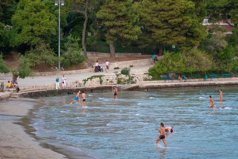 SPLIT, CROATIA - Jun 24, 2010: Picigin players on the sand beach Bacvice in S Stock Photos
