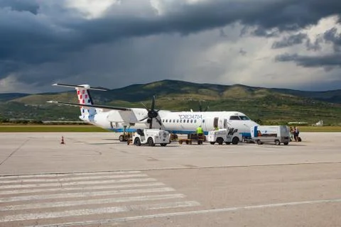 Split, croatia - jun 6: croatia airlines dash 8 q400 parked on a runway  Stock Photos