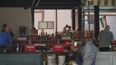 Split, Croatia- June 08 2022: Traditional Farmers Market Vendor Selling Drinks Stock-Footage 222777398
