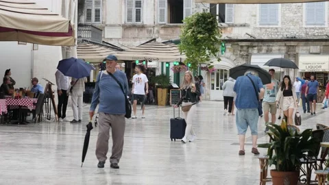 Split, Croatia- June 09 2022: Tourist Walking Around Central Square in Split Stock Footage 203536656