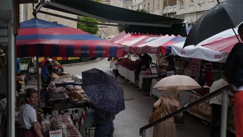 Split, Croatia- June 09 2022: People with Umbrella at Market in Split Stock Footage 203707287