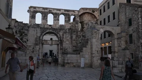 Split, Croatia- June 09 2022: Tourists Walking Street and Roman Ruins Background Stock Footage 204720740