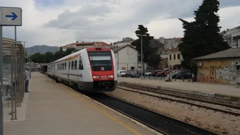 Split, Croatia- June 09 2022: Croatian Commuter Train Arrives Train Station Stock Footage 206372061