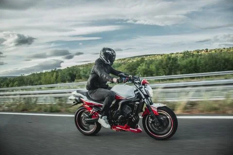 Split, Croatia June 2020 Driver on Yamaha Fazer motorbike, white and red Abar Stock Photos