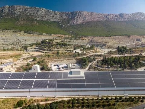 SPLIT, CROATIA - SEPTEMBER 9, 2026 CEMEX quarry and factory sit beneath rugge Stock Photos