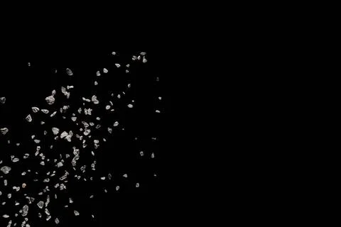Split debris of stone exploding against black background. Split debris of ... Foto stock