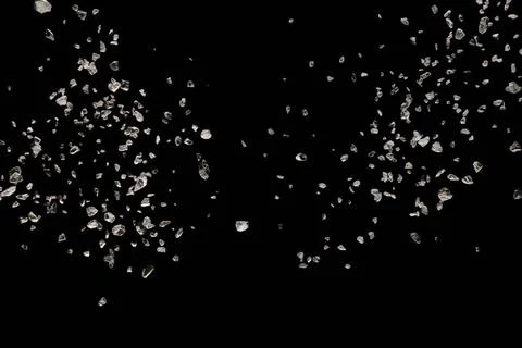 Split debris of stone exploding against black background. Split debris of ... Stock Photos