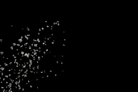 Split debris of stone exploding against black background 스톡 사진