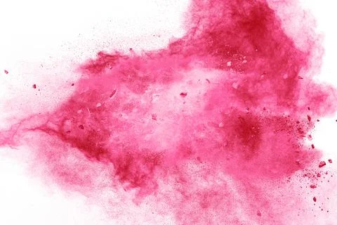 Split debris of stone exploding with pink powder against white background. Stock Photos