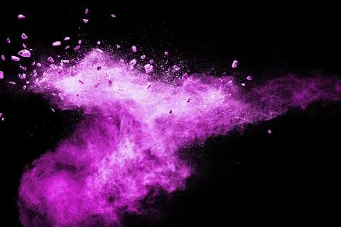 Split debris of stone exploding with pink dust powder against black background Stock Photos