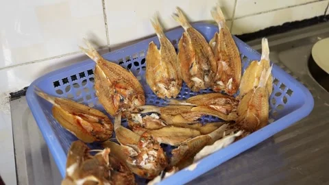 Split Dried Fish In Blue Plastic Kitchen Basket 動画素材 344550298