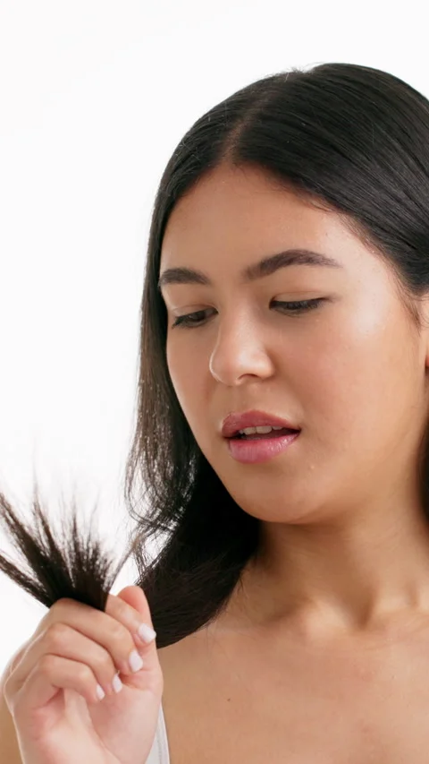 Split ends, beauty and hair with woman in studio for self care, growth fail and Stock Footage 333676907