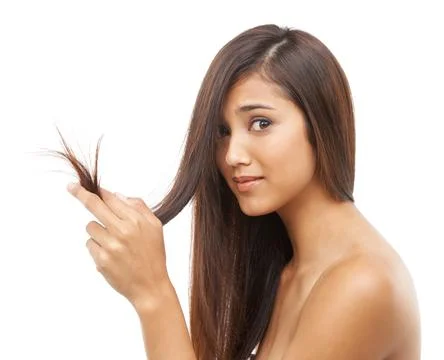Split ends driving you crazy. Portrait of an attractive young woman with long Stock Photos
