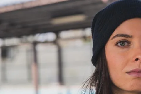 Split face of pretty girl posing in a metro station Stock Photos