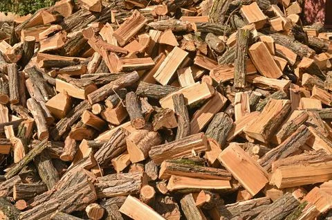 Split firewood for heating in winter. Stock Photos