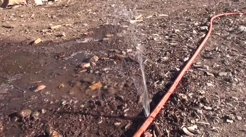 Split frozen hose leaking during winter water Stock Footage 45872509