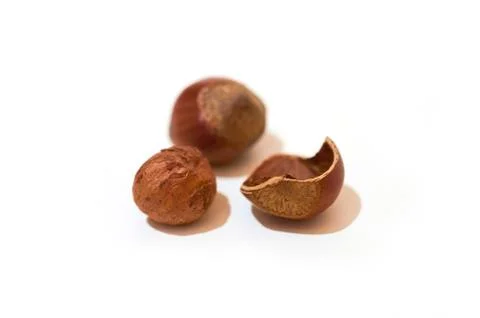 Split hazelnut, kernel and shell isolated on white background Foto stock