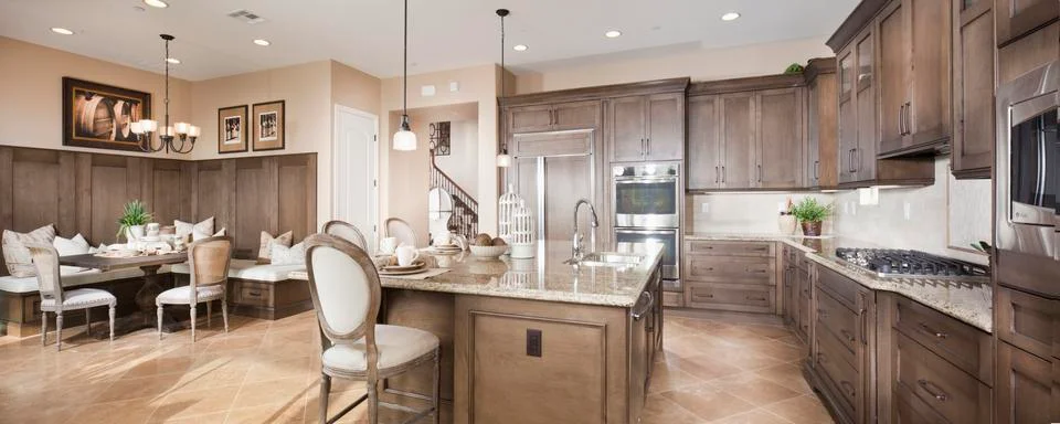 Split-level open plan dining area and kitchen at home Stock Photos