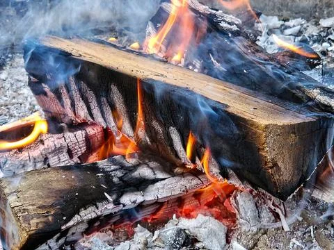 Split Logs On A Bonfire Stock Photos