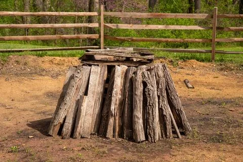 Split logs firewood form a circular stack for a bonfire Stock Photos