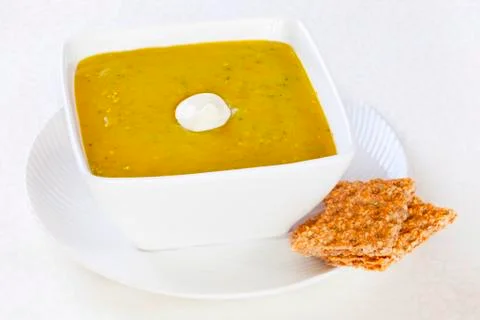 Split pea soup with yoghurt Stock Photos
