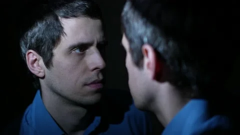 Split personality concept .Reflection of a man at night Stock Footage 148336239