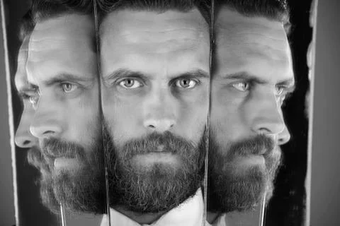 Split personality. face of serious bearded hipster man, businessman reflecting Stock Photos