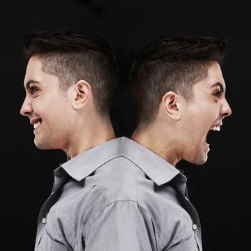 Split personality. Studio shot of a young man showing two sides of his person Foto stock