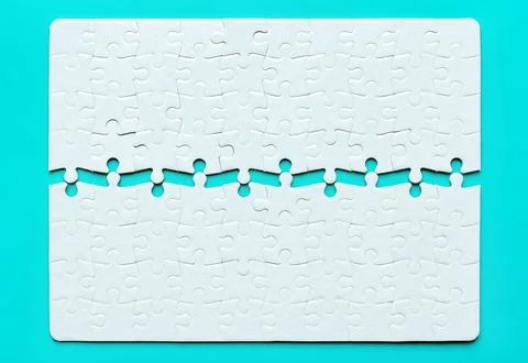 Split Rectangular Jigsaw Puzzle Isolated on Blue Foto stock