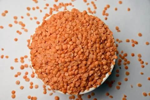 Split Red Lentils (Masoor Dal) Top View  White Defocus Background Macro Pho.. Stock Photos
