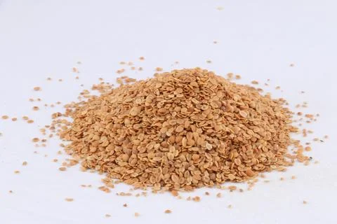 Split Roasted Coriander Seeds also know as Dhana Dal or Sukh Mukh isolated .. Stock Photos