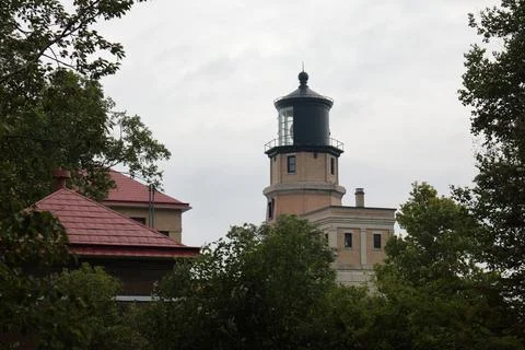 Split Rock Lighthouse on Lake Superior Coast Under Cloudy Sky Stock Photos
