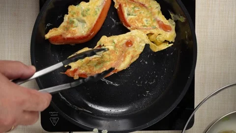 Split Sausages with Golden Egg and Green Herbs in a Frying Pan Video stock 342616667
