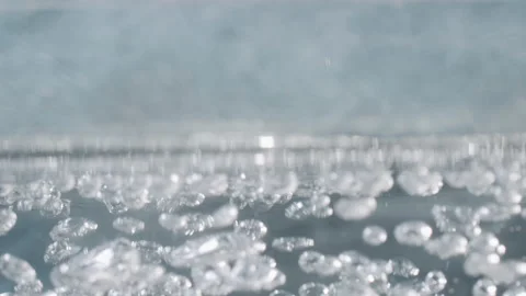 Split screen of boiling water in 4k, macro shot of small and big air bubbles Video stock 135882657
