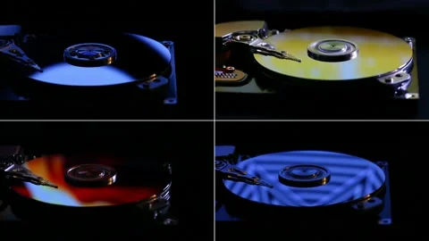 Split screen. Computer hard drive in color light. Disassembled rotating disc. Stock Footage 202240906
