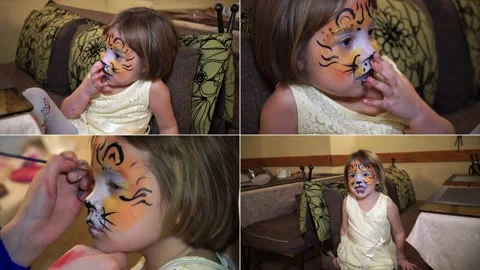 Split screen. The little girl painted her face in gouache. Face art picture o Stock Footage 142748698
