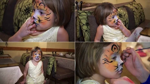 Split screen. The little girl painted her face in gouache. Face art picture o Stock Footage 147569615