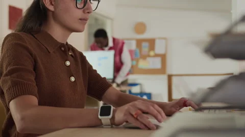 Split Screen of Office Workers Engaged in UI Design and Messaging on Computer Video stock 292734912