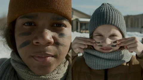 Split Screen Portraits of Boy and Girl with War Stripes on Face Stock Footage 253521551