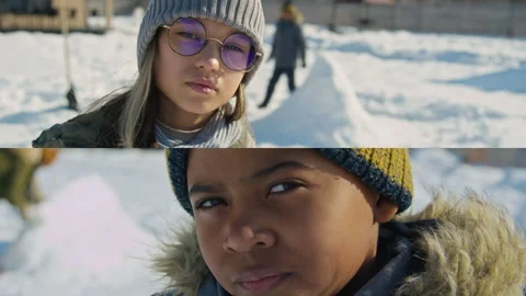Split Screen Portraits of Two Diverse Kids Playing Outdoors in Winter Stock Footage 253521548