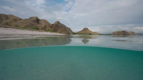 Split shot at the beach in the Komodo National Park 스톡 동영상 331145899