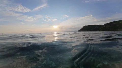 Split Shot of Ocean and Island at Sunset Stock Footage 333768118