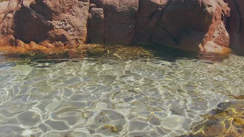 Split-shot, over-under shot. Underwater shot of the coast of a beach of Isola Vídeos de archivo 164774663
