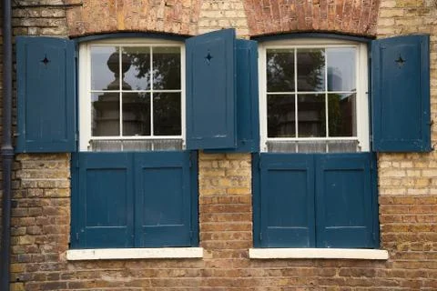 Split shutters for extra privacy. Stock Photos